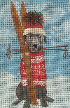 Fab Funky whimsical needlepoint canvas of a black labrador dog wearing a fair isle sweater and a beanie with skis and ski poles in the snow