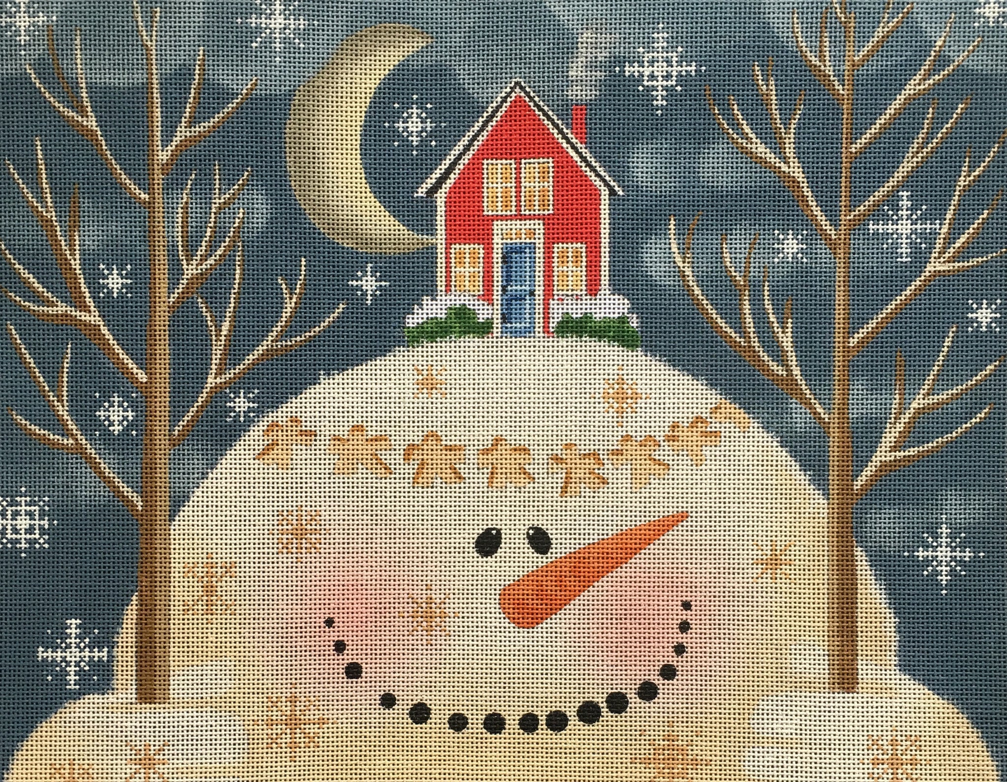 Vallerie Needlepoint Gallery needlepoint canvas of a snowman holding two trees with a house on his head and snow angels